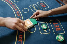 Filipino player watching live dealer baccarat table on mobile phone